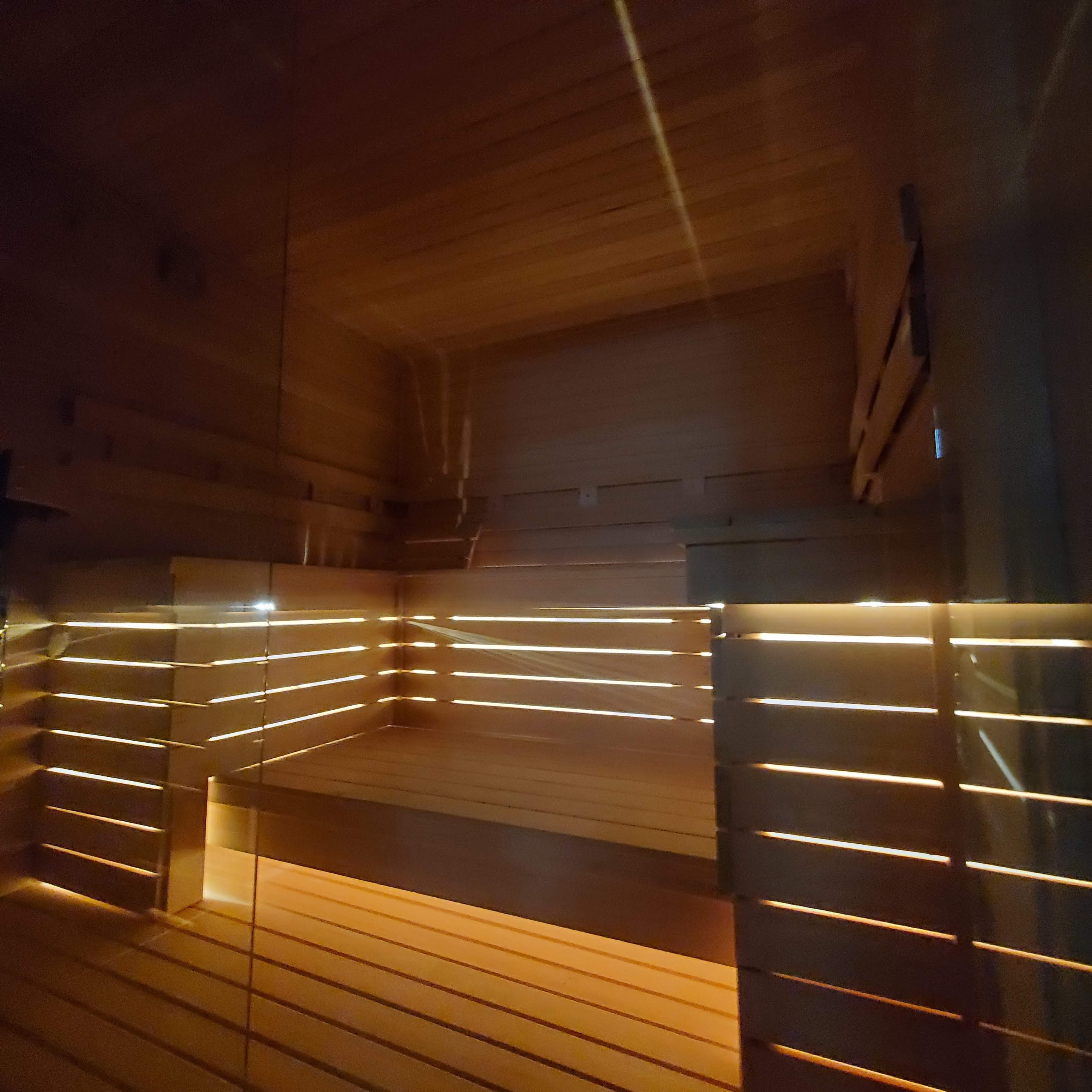 Sauna interior with warm ambient bench lighting