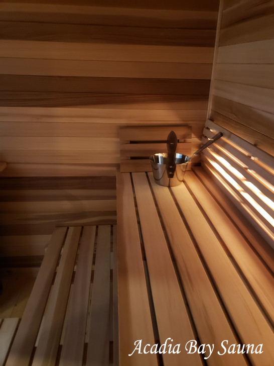 Sauna bench detail with water bucket